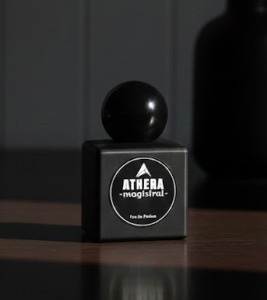 Athera Magistral premium perfumes and fragrances bottle on wooden table with luxury aesthetic