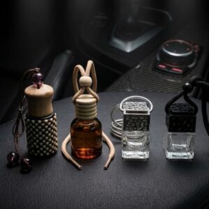 Luxury car perfume bottles placed on dark background – best luxury car air freshener India for premium fragrance experience